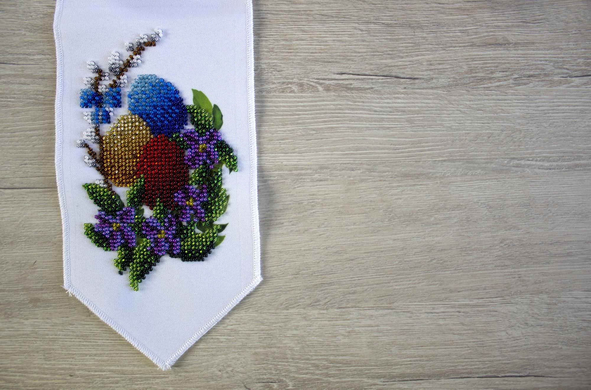 Assorted embroidered samples on table